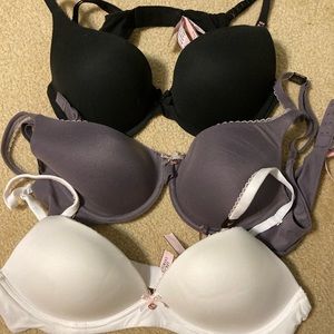 3 NWT Victoria Secret bras. Never worn. 1 black, 1 white and 1 plum. Size 36B.